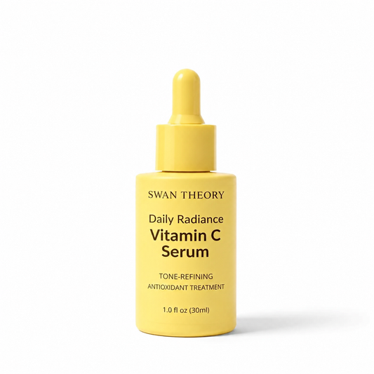 Yellow bottle of Swan Theory Daily Radiance Vitamin C Serum on a white background